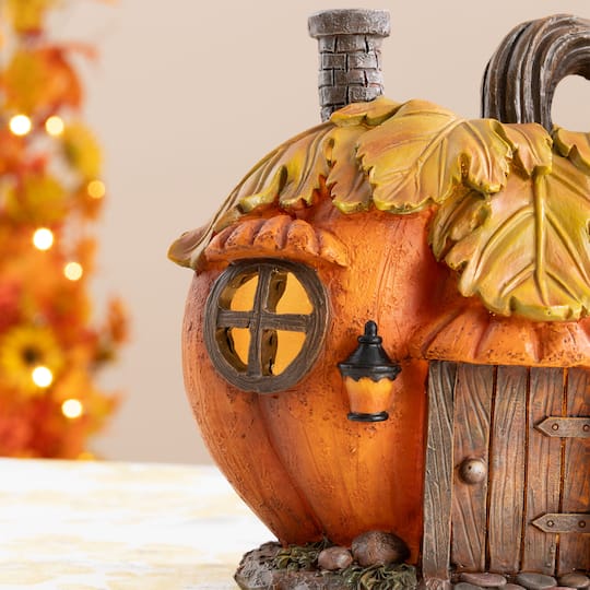 Glitzhome® 8.5" Lighted Fall Resin Pumpkin House Table Decor with Timer
